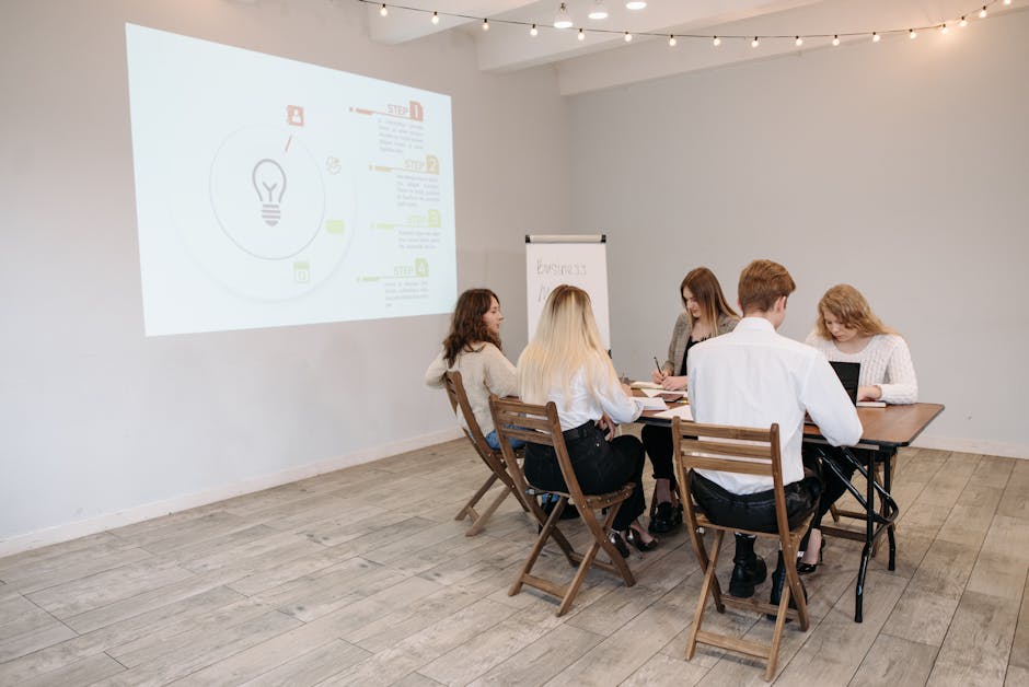 Group of young professionals collaborating in a bright office setting.